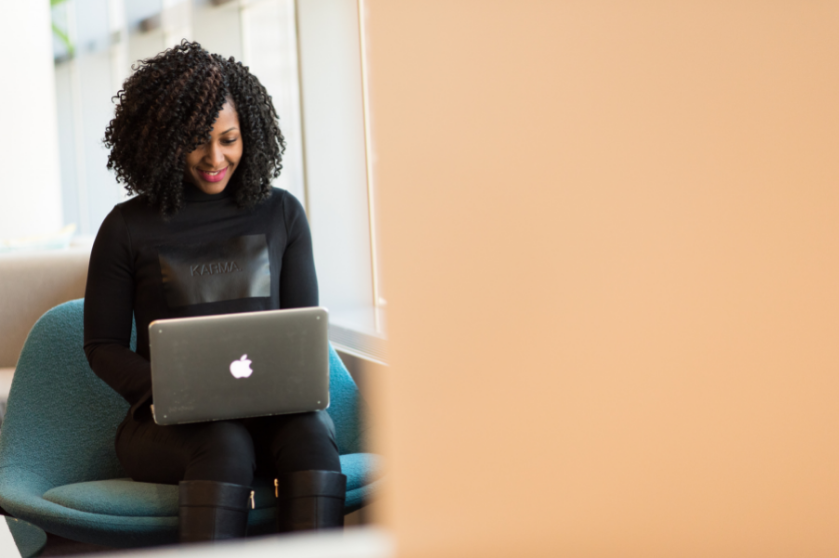 A student works on a laptop from their home office.