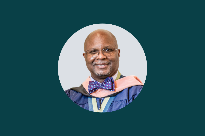 A headshot of the pastor on a green background.