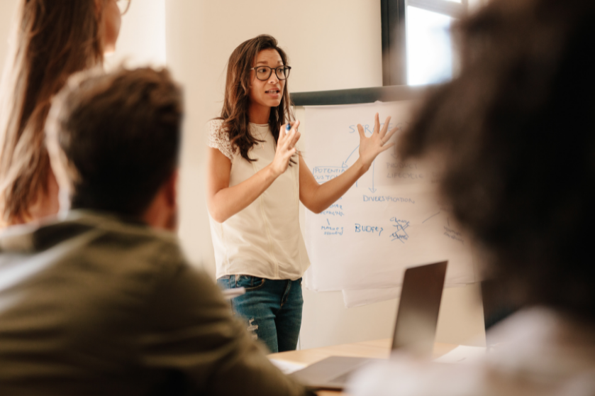 Woman gives a talk in a classroom.